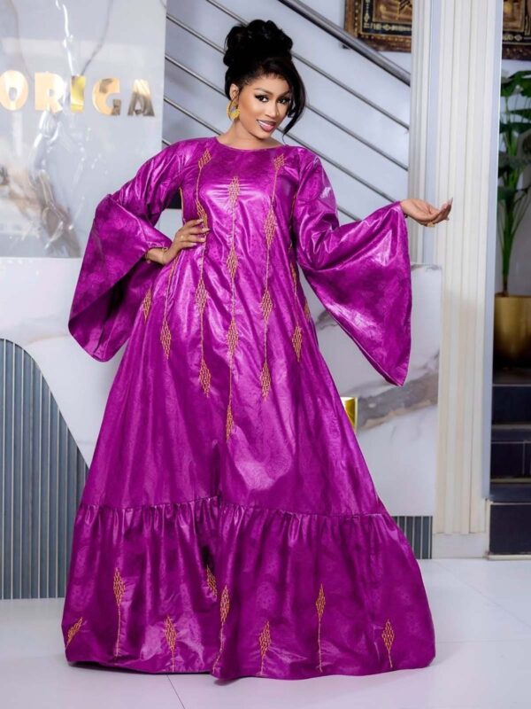 Bazin wedding guest dress in magenta Getzner with embroidered detail