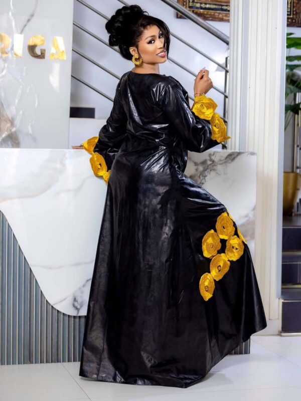 Black bazin gold embroidery dress 2 Custom bazin dress with embroidered sleeves and full-length boubou design