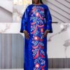 Elegant bazin dress for wedding guest in blue Getzner with floral embroidery